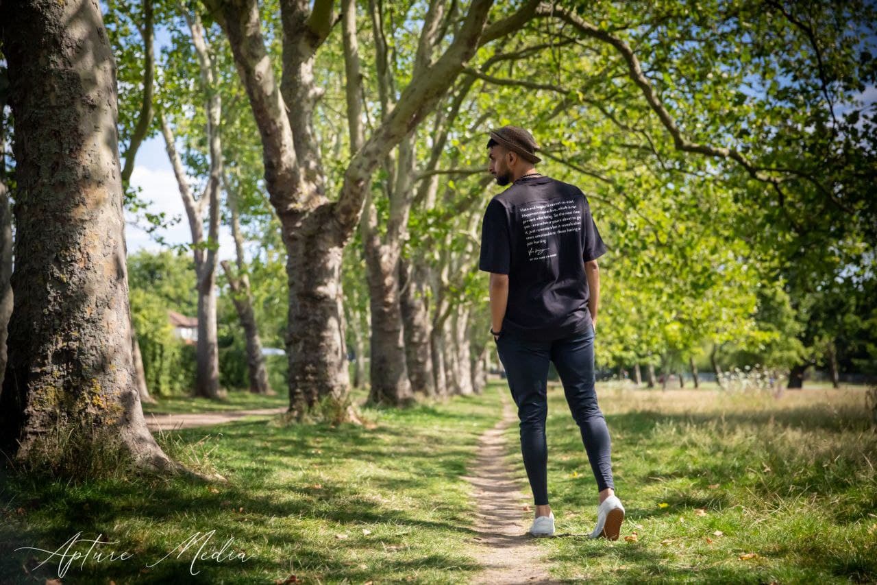 Riico walking a tree-lined path